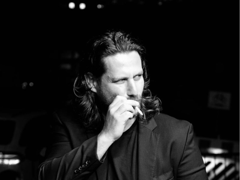 Adam Bousdoukos. Actor. Having a smoke next to the Red Carpet.